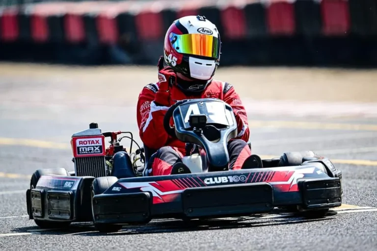 Samuel racing kart number 45 with Club100 branding