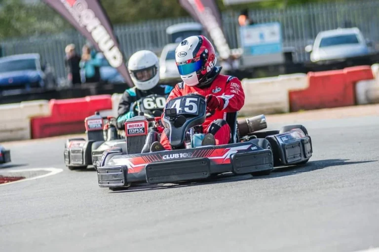 Kart number 45 racing close behind another kart