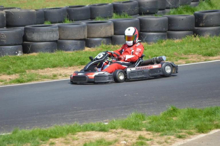 Kart racing along a grass-lined track