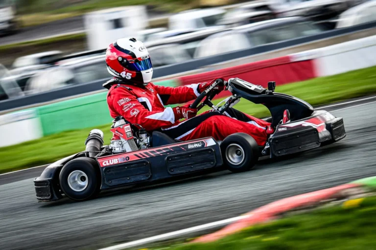 Samuel racing his kart past the tyre wall