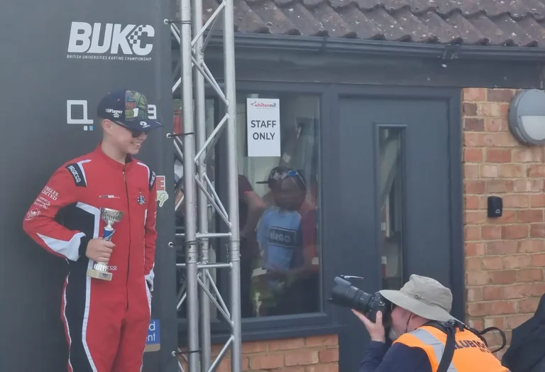 Samuel at a trophy presentation