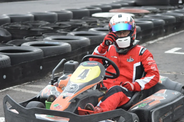 Samuel sitting in his kart with his helmet on