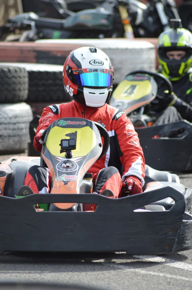 Samuel sitting in kart number 4 in the paddock