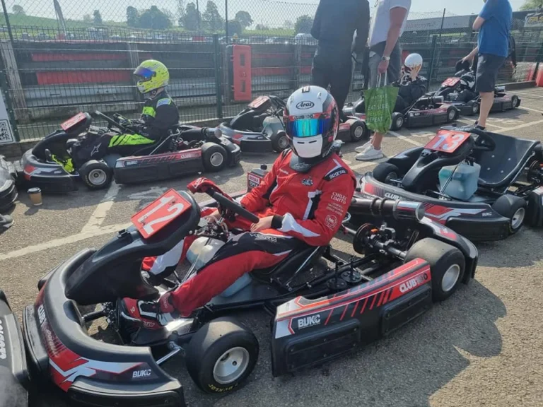 Samuel in his kart in the paddock