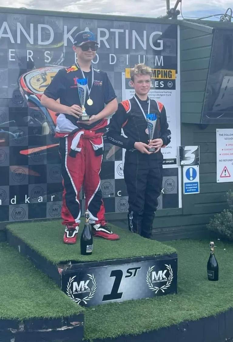 Samuel on the top step of the podium
